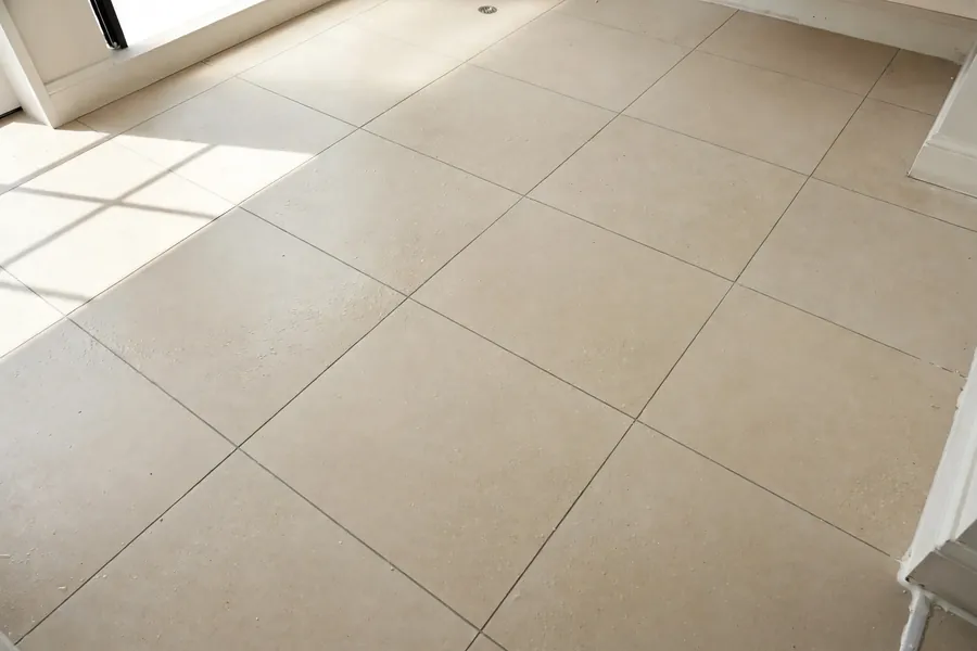 Large porcelain floor tile in a bright bathroom