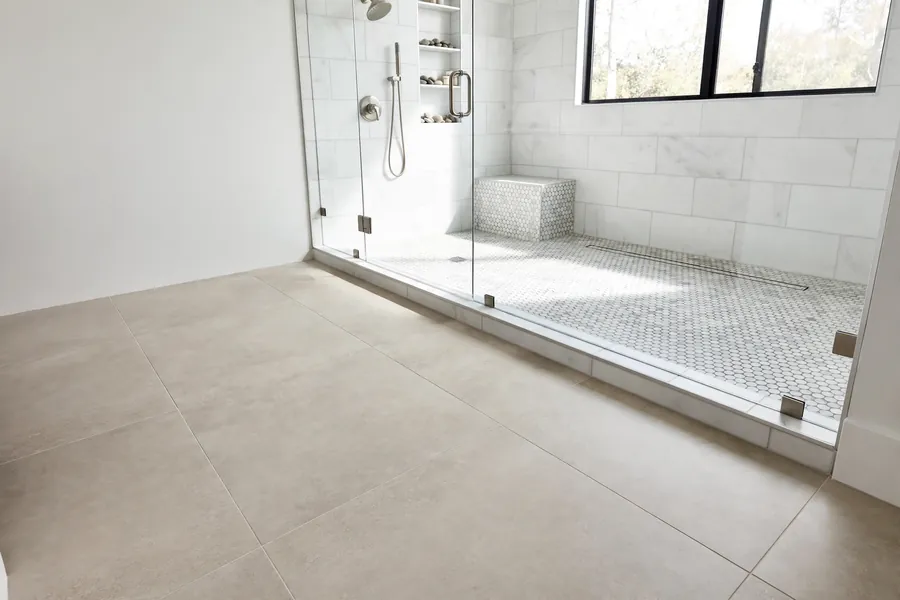 Large porcelain floor tile with a small mosaic shower floor