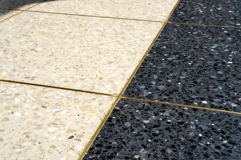 Terrazzo floor in two colors with brass divider strips