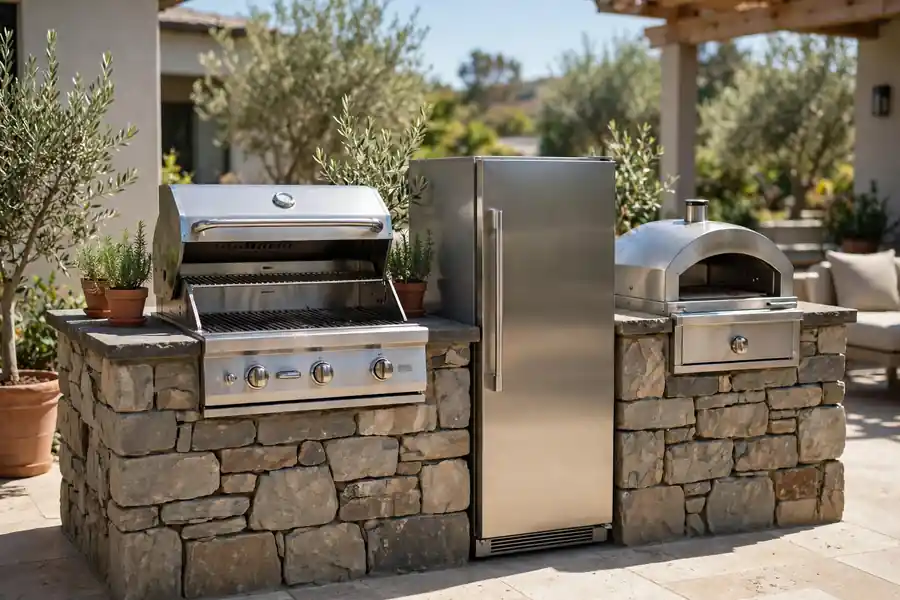 A built-in gas grill with a side burner, outdoor refrigerator, and prep counter in an outdoor kitchen island.