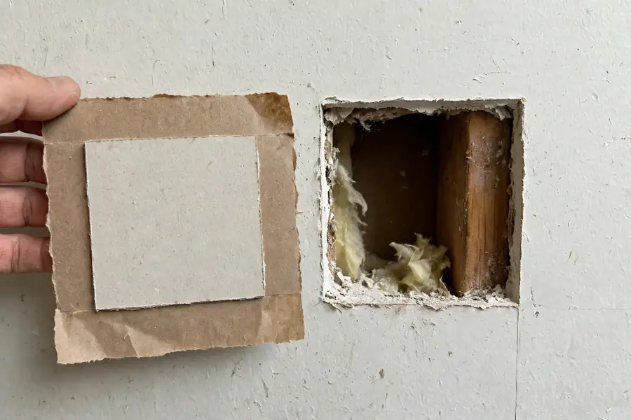California patch with paper flange beside a square hole